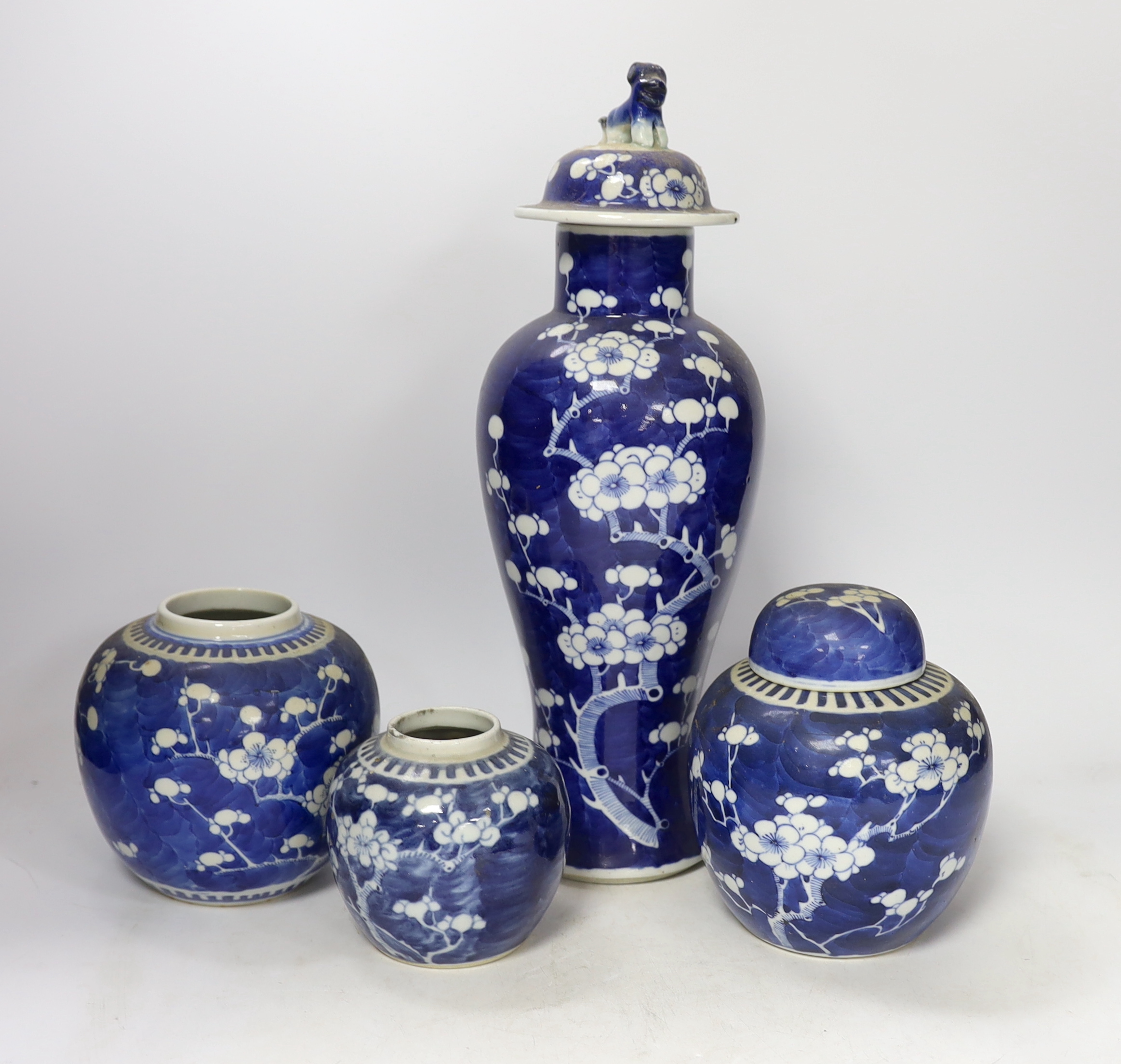 Three early 20th century Chinese blue and white jars (one with cover) and a similar vase and cover (a.f.), tallest 37cm